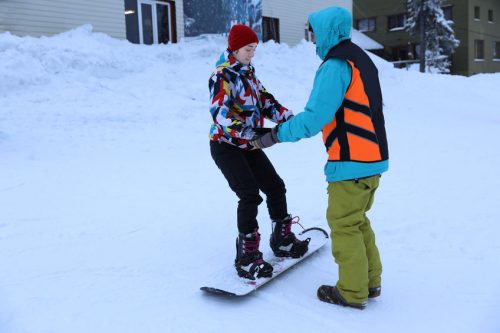 snowboard instructor teaching at a ski resort