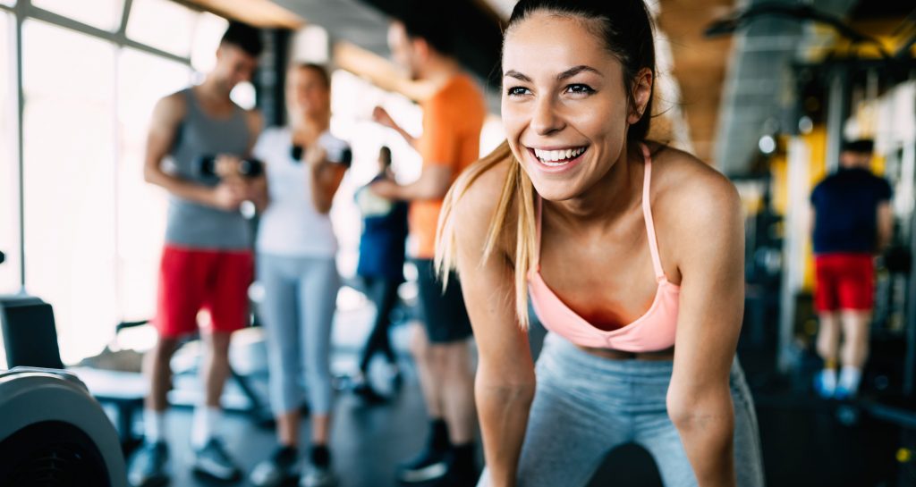 employee happily exercising and feeling strong